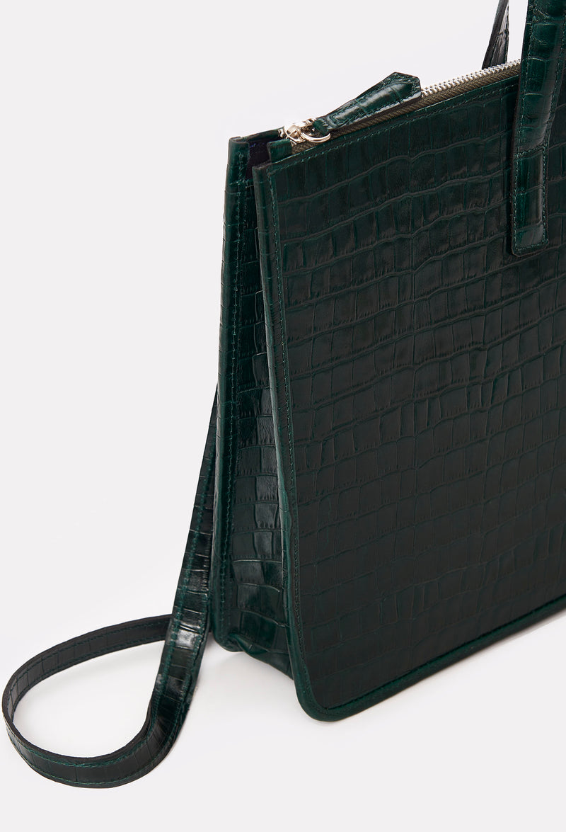 Partial photo of a Green Croco Leather Slim Briefcase with a detachable leather strap and a main zippered compartment.