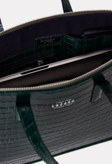 Interior photo of a Green Croco Leather Slim Briefcase showing its main zippered compartment packed with a computer, internal multifunctional pockets and Lazaro silver ironwork.