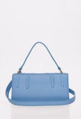 Rear of a Sky Leather Crossbody Flap Bag Hilda with a removable and adjustable strap.