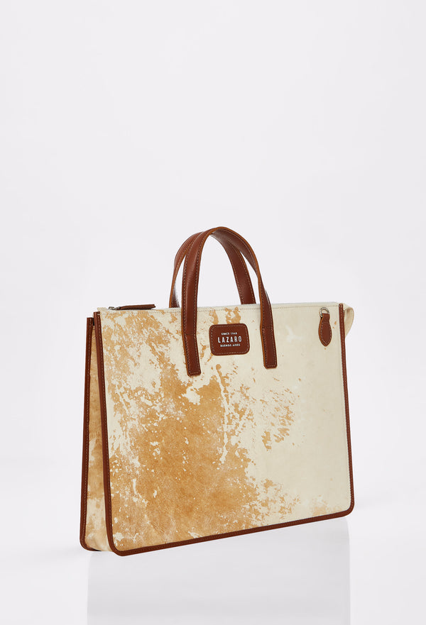 Side of a Vintage Cowhide Leather Slim Briefcase with Tan leather details and Lazaro logo.