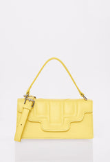 Front of a Yellow Leather Crossbody Flap Bag Hilda with a raised design flap, Lazaro logo and a removable and adjustable strap.