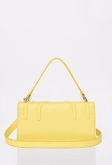 Rear of a Yellow Leather Crossbody Flap Bag Hilda with a removable and adjustable strap.