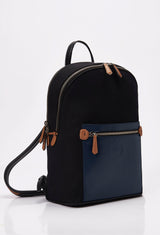 Side of a Black Canvas and Leather Backpack with blue and tan leather details, main compartment, laptop compartment, Lazaro logo and front multifunctional pockets.