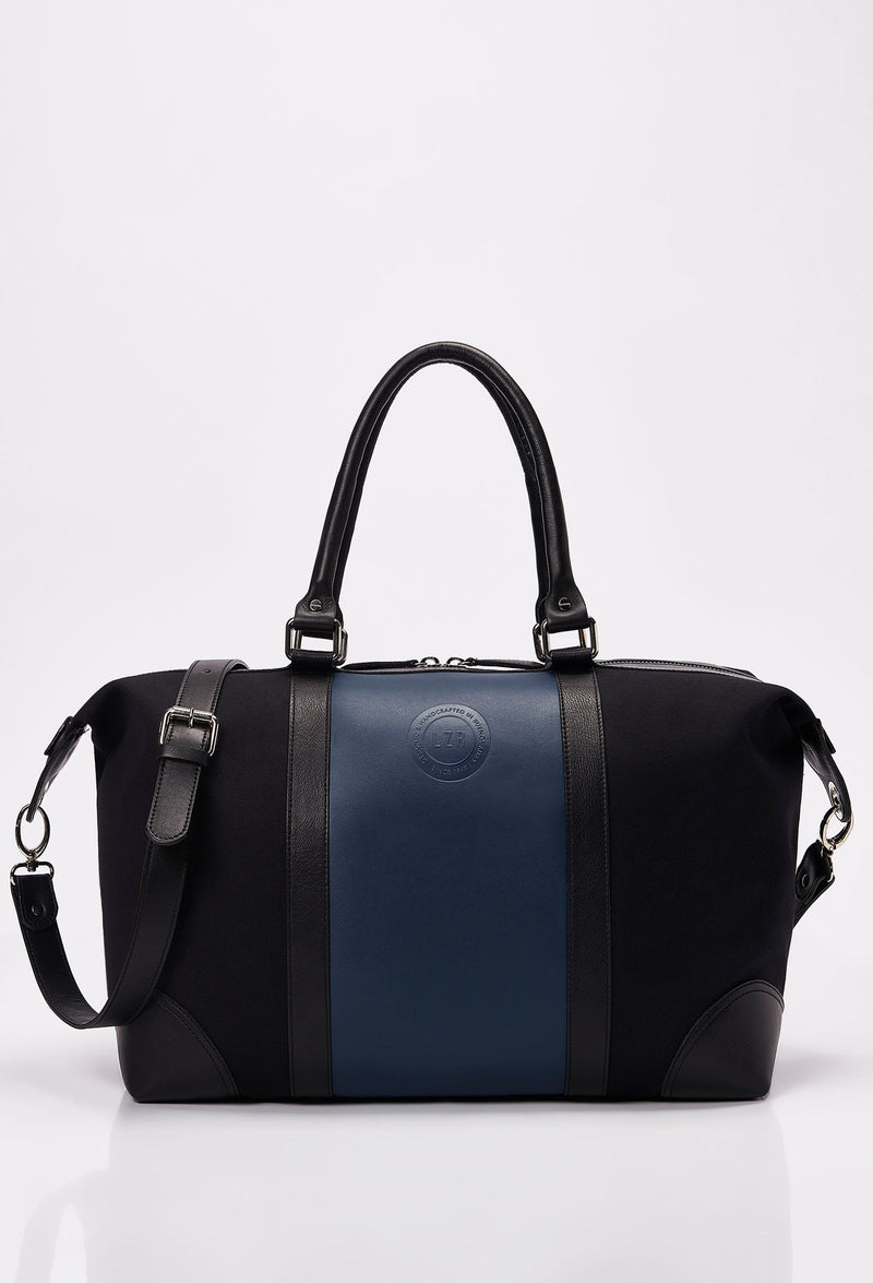 Front of a Black Canvas and Leather Duffel Bag with a blue leather strap, Lazaro logo and leather handles and shoulder straps.