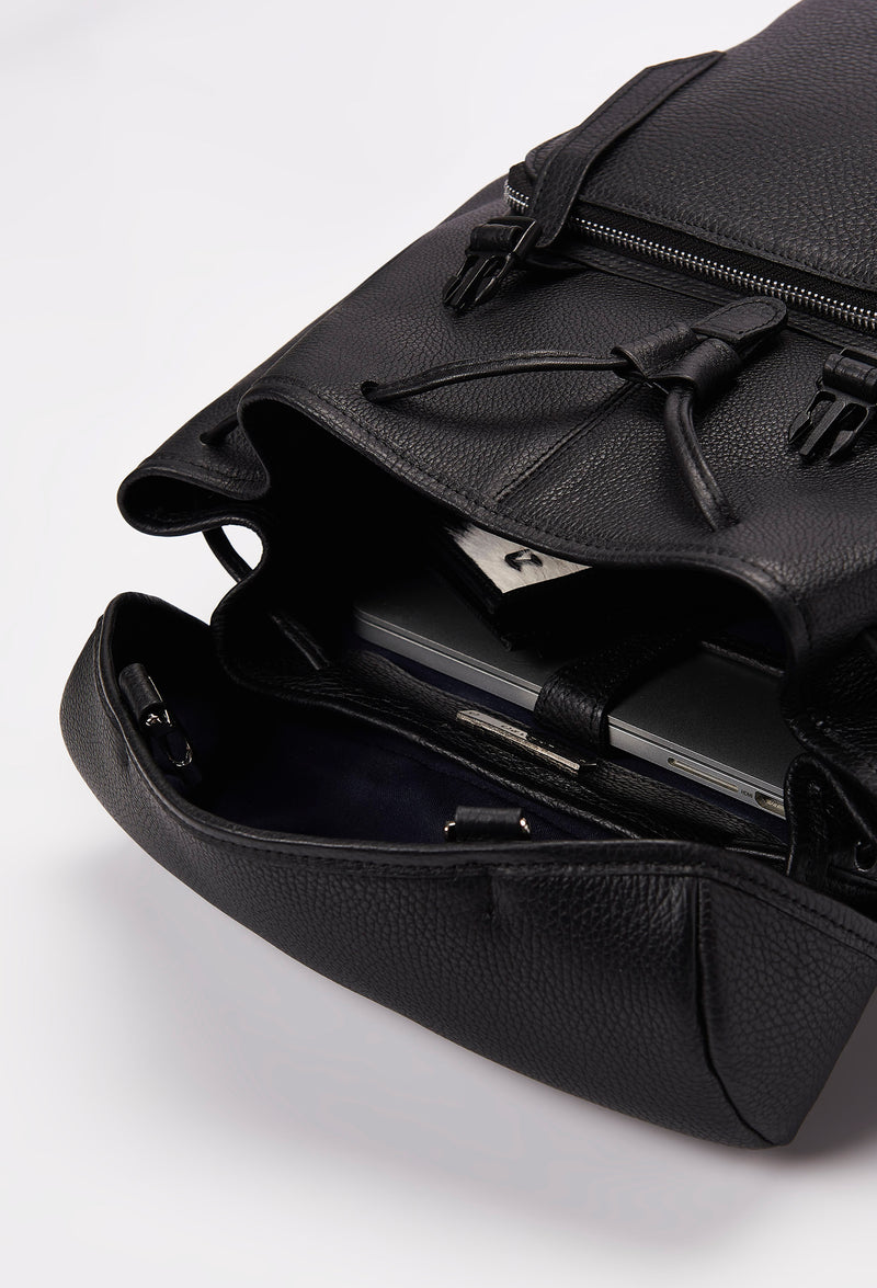 Interior of a Black Large Leather Backpack with Buckle Closure that shows a main compartment with a Lazaro wallet and a special compartment for a computer.