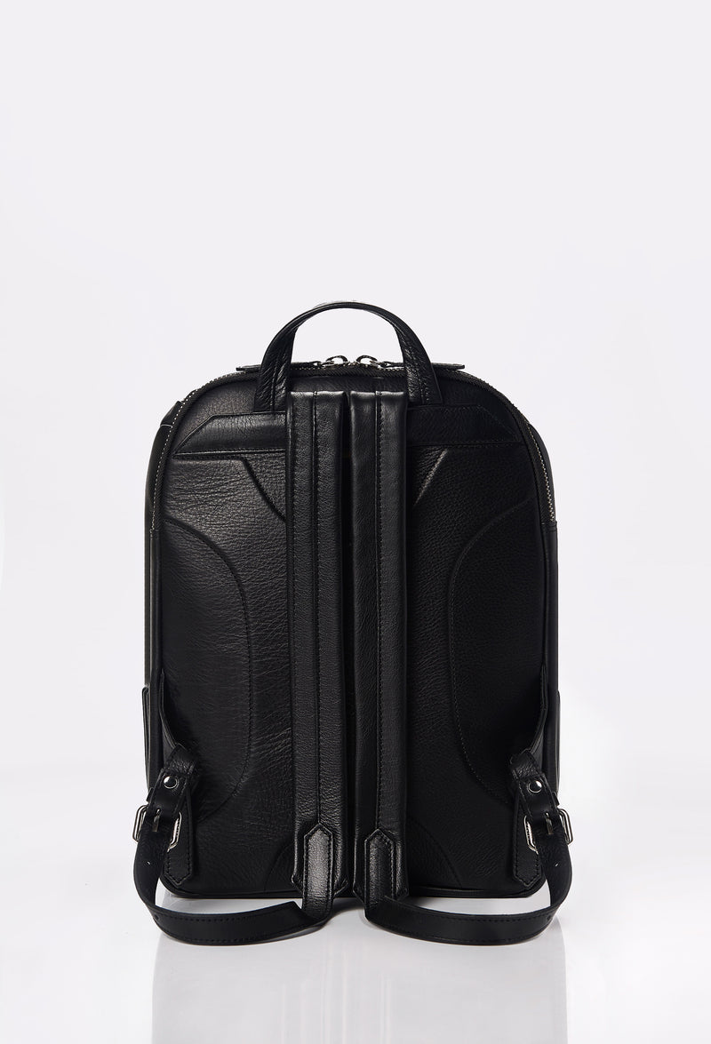 Rear of a Black Leather Backpack ergonomically shaped with leather padded and adjustable straps.