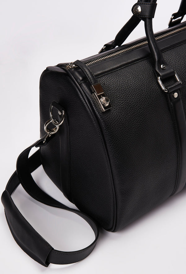 Partial photo of a Black Leather Duffel Bag with lock closure, a zippered main compartment, and a detachable leather shoulder strap.