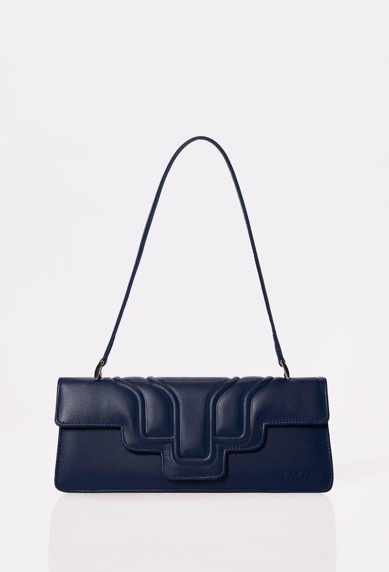 Front of a Blue Leather Shoulder Flap Bag Hilda with a raised design flap and Lazaro logo.