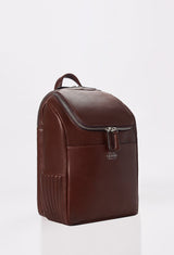 Side of a Coffee Leather Backpack with side needlework, main compartment, Lazaro logo and a front pocket.