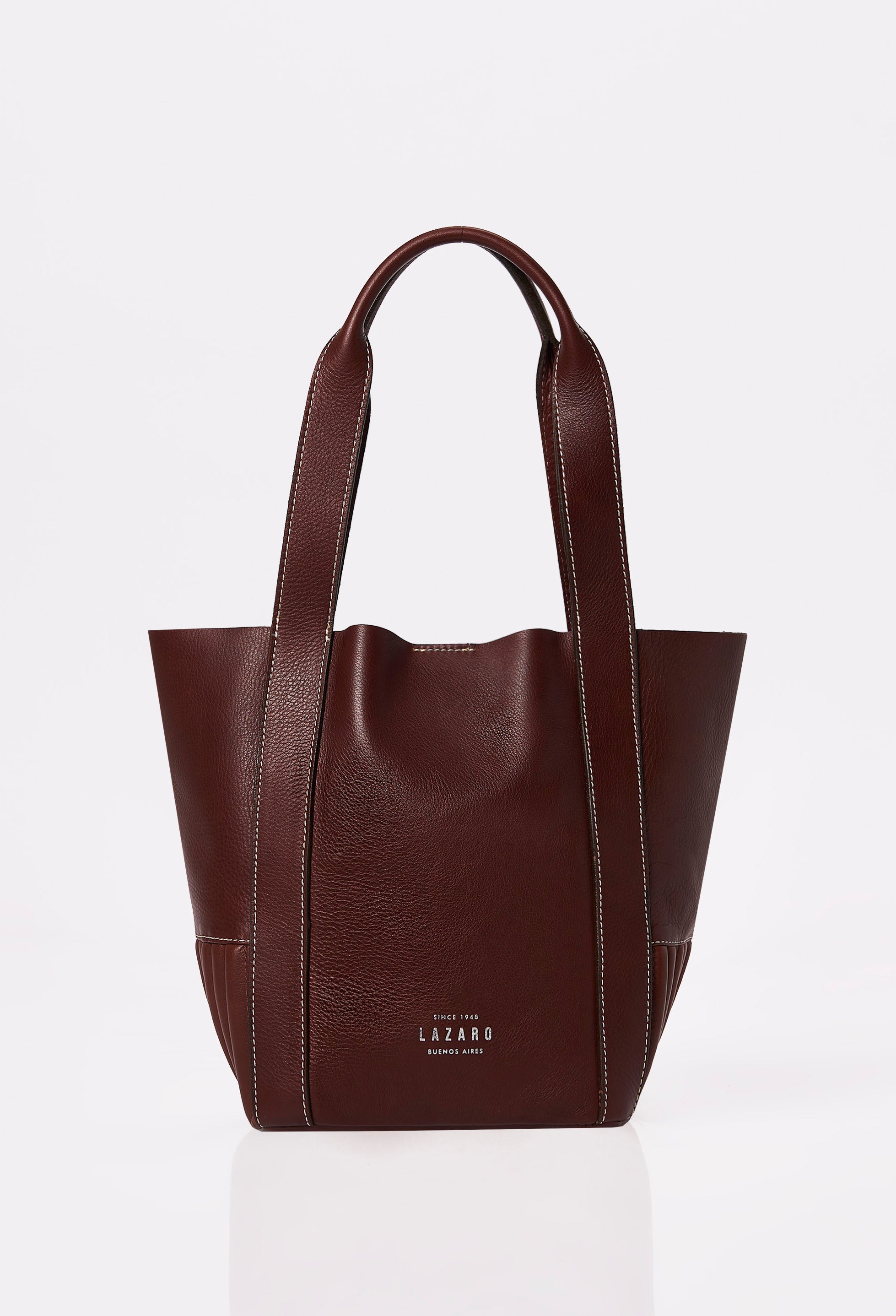 Front of a Coffee Leather Small Bucket Bag Ushuaia with Lazaro logo and contrast stitching highlights.