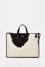 Front of a Cowhide Leather Slim Briefcase with black leather details and Lazaro logo.