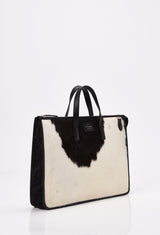 Side of a Cowhide Leather Slim Briefcase with Black leather details and Lazaro logo.
