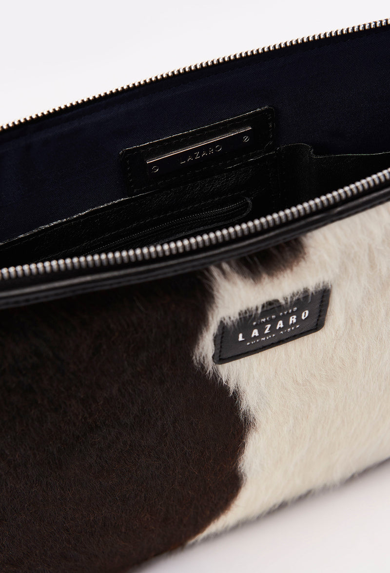 Partial photo of a Cowhide Leather Slim Computer Case showing its main zippered compartment, internal multifunctional pockets and Lazaro silver ironwork.