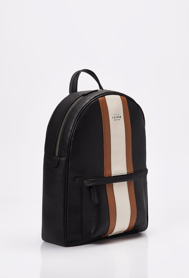 Side of a Lightweight Leather Backpack made from black Full-Grain pebbled leather with Nappa leather trims in tan and off white. It has a main zippered compartment, the Lazaro logo and a front zippered pocket.