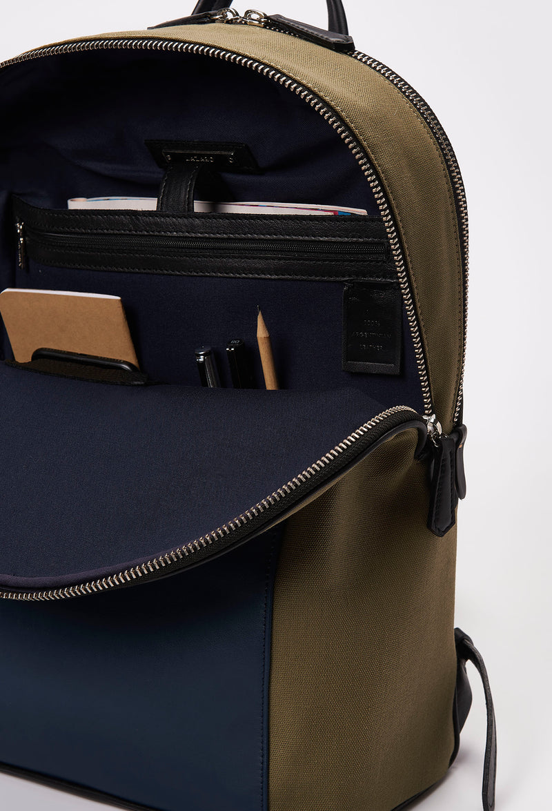 Partial photo of a Olive Canvas and Leather Backpack with Laptop Compartment that shows internal multifunctional pockets.