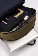 Interior of a Olive Canvas and Leather Backpack that shows a main compartment with a zippered pocket and a cell phone pocket, and a special zippered and padded compartment for a computer.