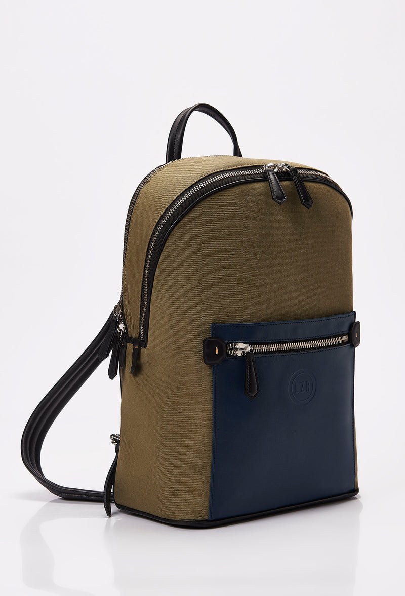 Side of a Black Canvas and Leather Backpack with blue and black leather details, main compartment, laptop compartment, Lazaro logo and front multifunctional pockets.