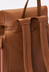Partial photo of a Tan Large Leather Backpack with Buckle Closure showing its ergonomically shaped rear, leather padded and adjustable straps and a hidden zippered pocket.