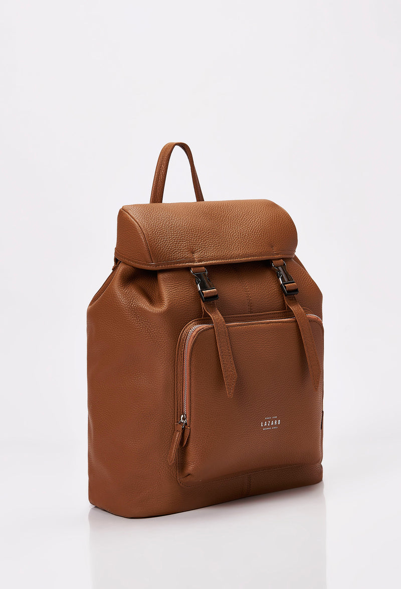 Side of a Tan Large Leather Backpack with Buckle Closure, that shows a slver Lazaro logo and a front zippered pocket.