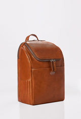 Side of a Tan Leather Backpack with side needlework, main compartment, Lazaro logo and a front pocket.