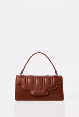 Front of a Tan Leather Crossbody Flap Bag Hilda with a raised design flap and Lazaro logo.