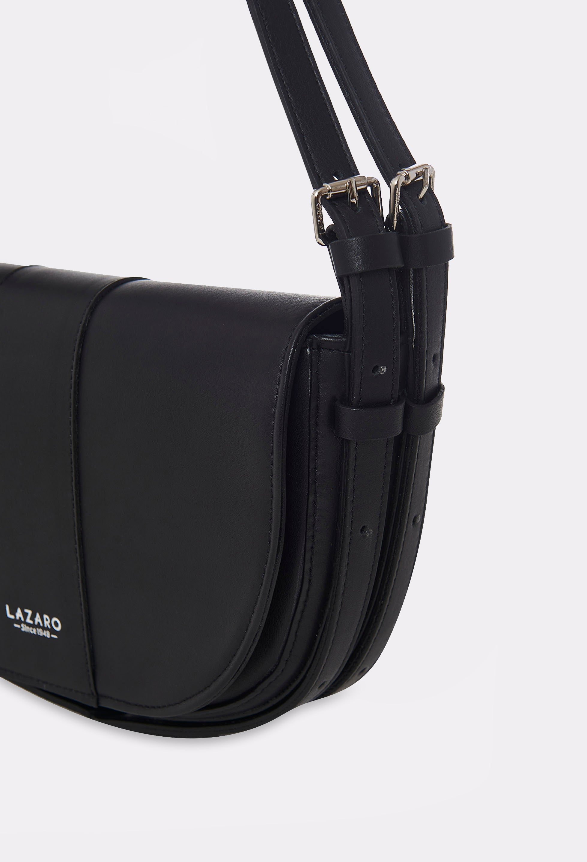 Partial photo of a Black Leather Shoulder Bag Montana with silver embossed Lazaro logo and double leather strap, equipped with metal buckles and cufflinks.