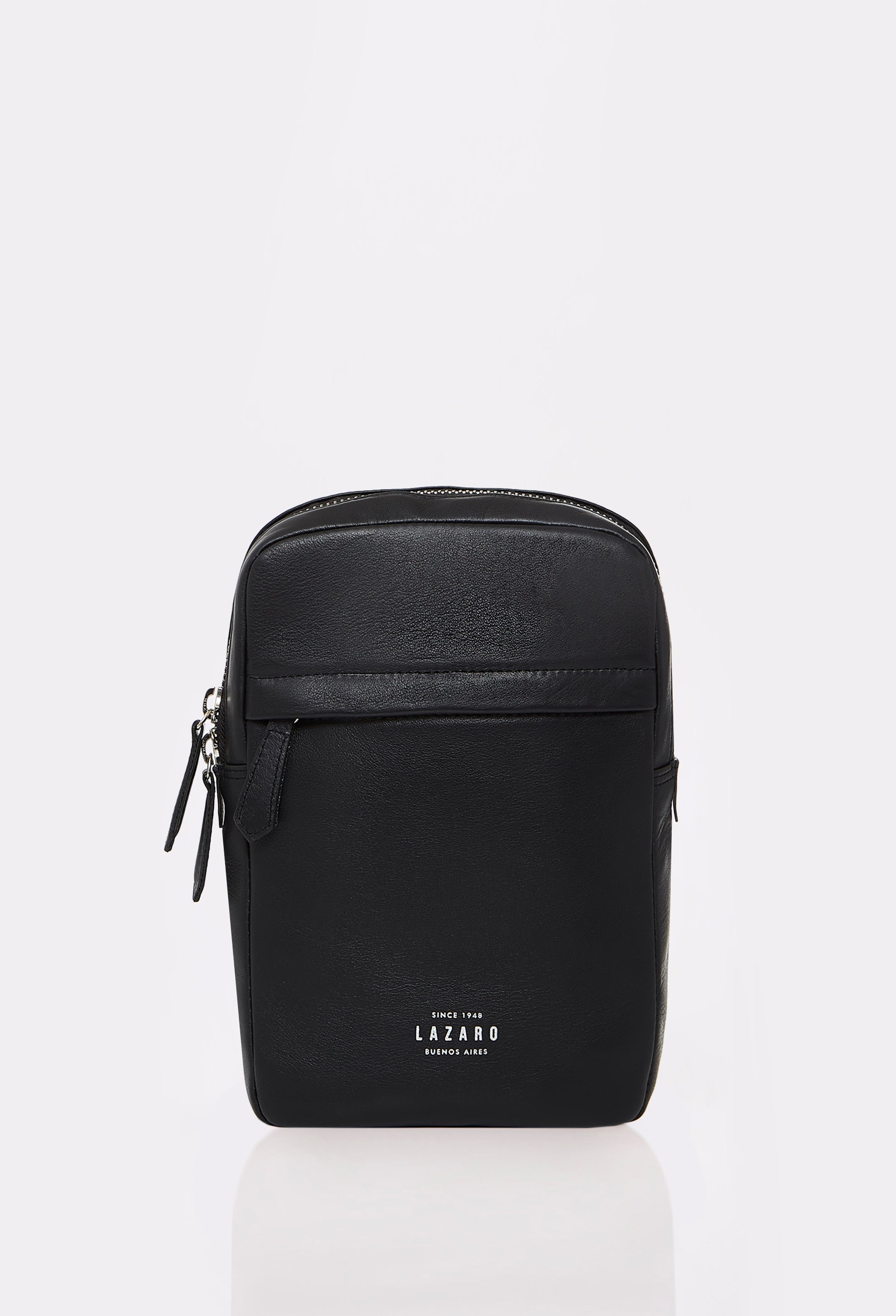 Front of a Black Leather Sling Bag Salerno made out of Argentinian Bridge Leather with Lazaro logo, a main compartments and an external zippered pocket.