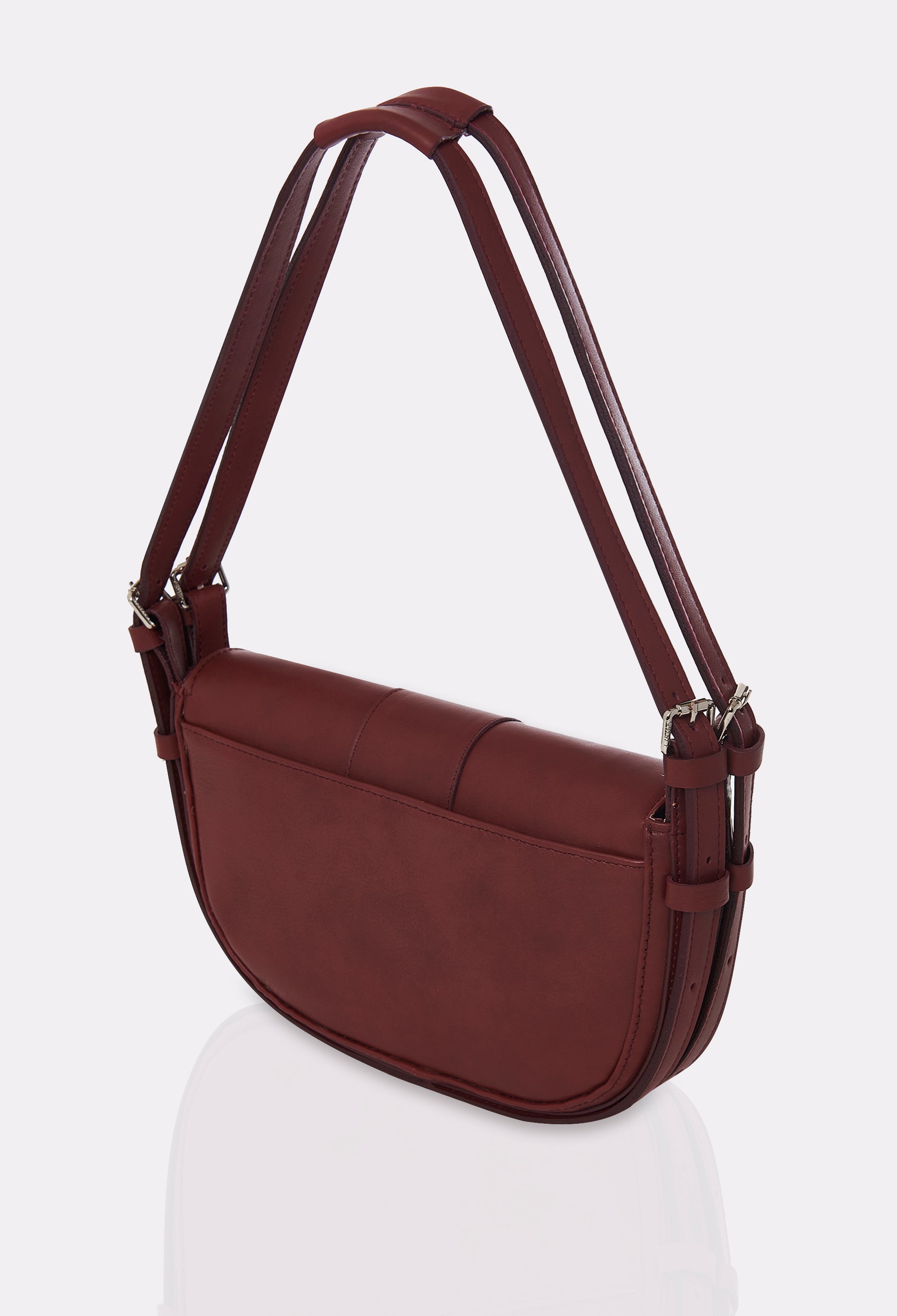 Rear of a Burgundy Leather Shoulder Bag Montana with a double leather strap and an external multifunctional pocket.