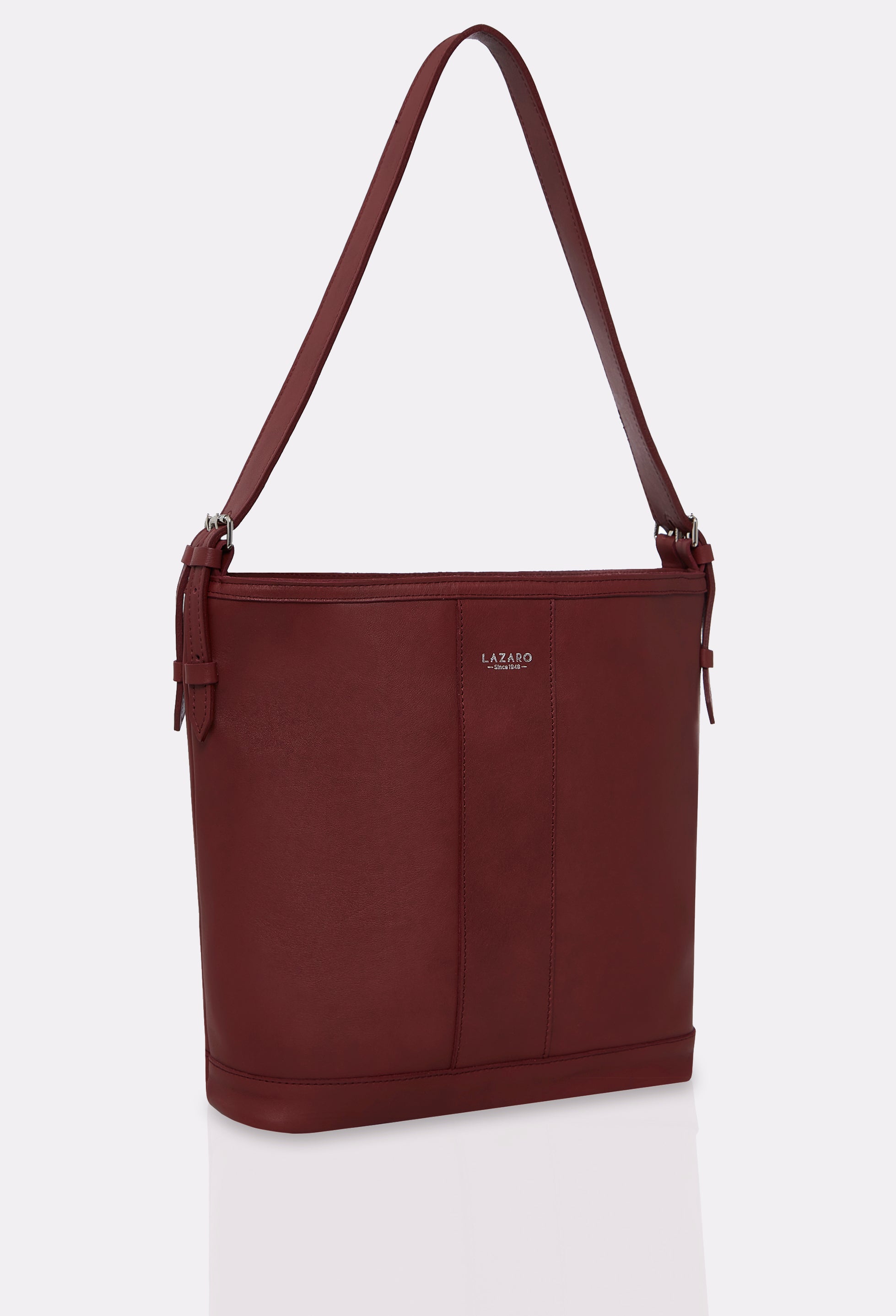 Side of a Burgundy Leather Tote Bag Montana with leather padded and adjustable strap and silver embossed Lazaro logo.