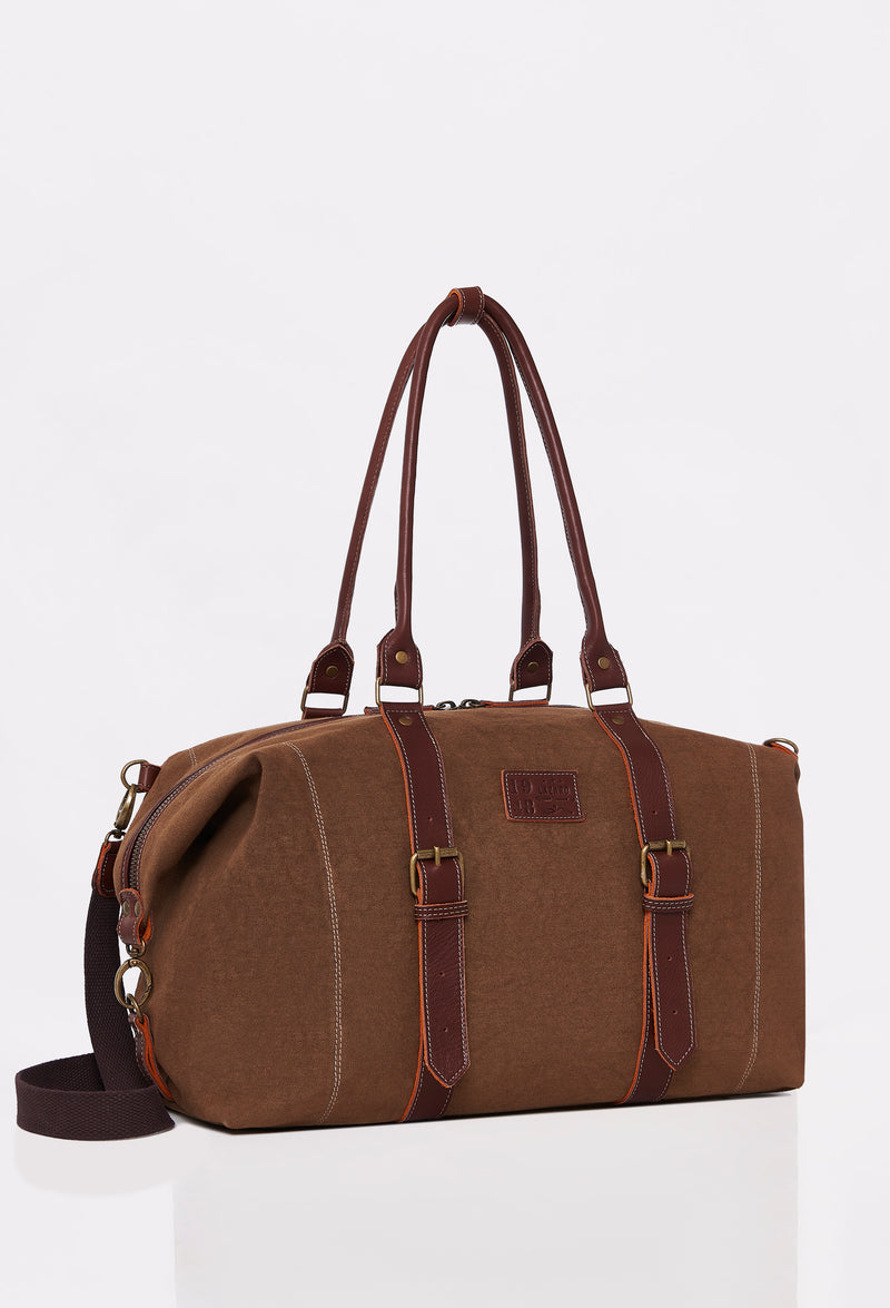 Side of a Coffee Canvas Duffel Bag with Lazaro logo, leather handles and a detachable shoulder strap.