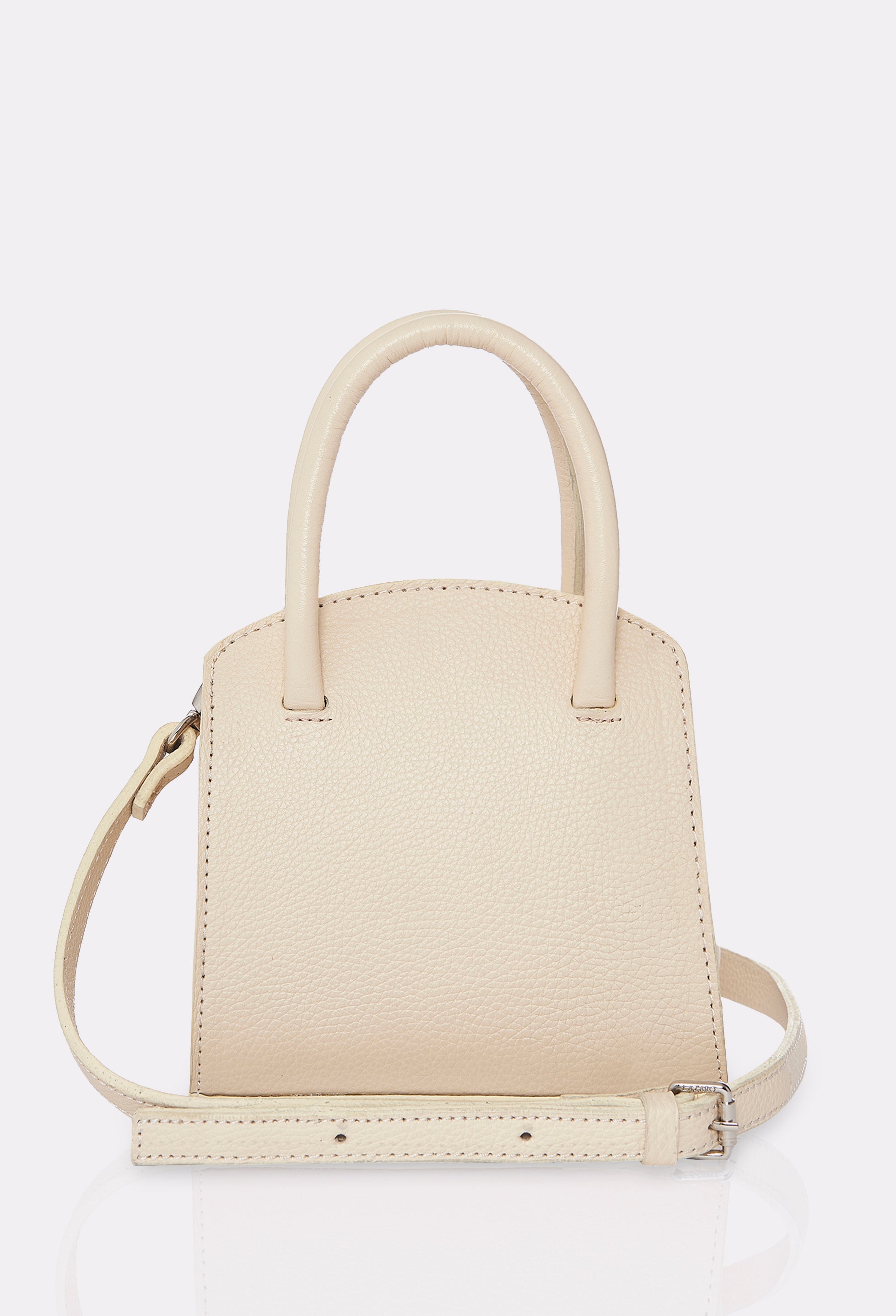 Rear of a Off White Leather Mini Bag Margot with a leather adjustable and detachable strap.