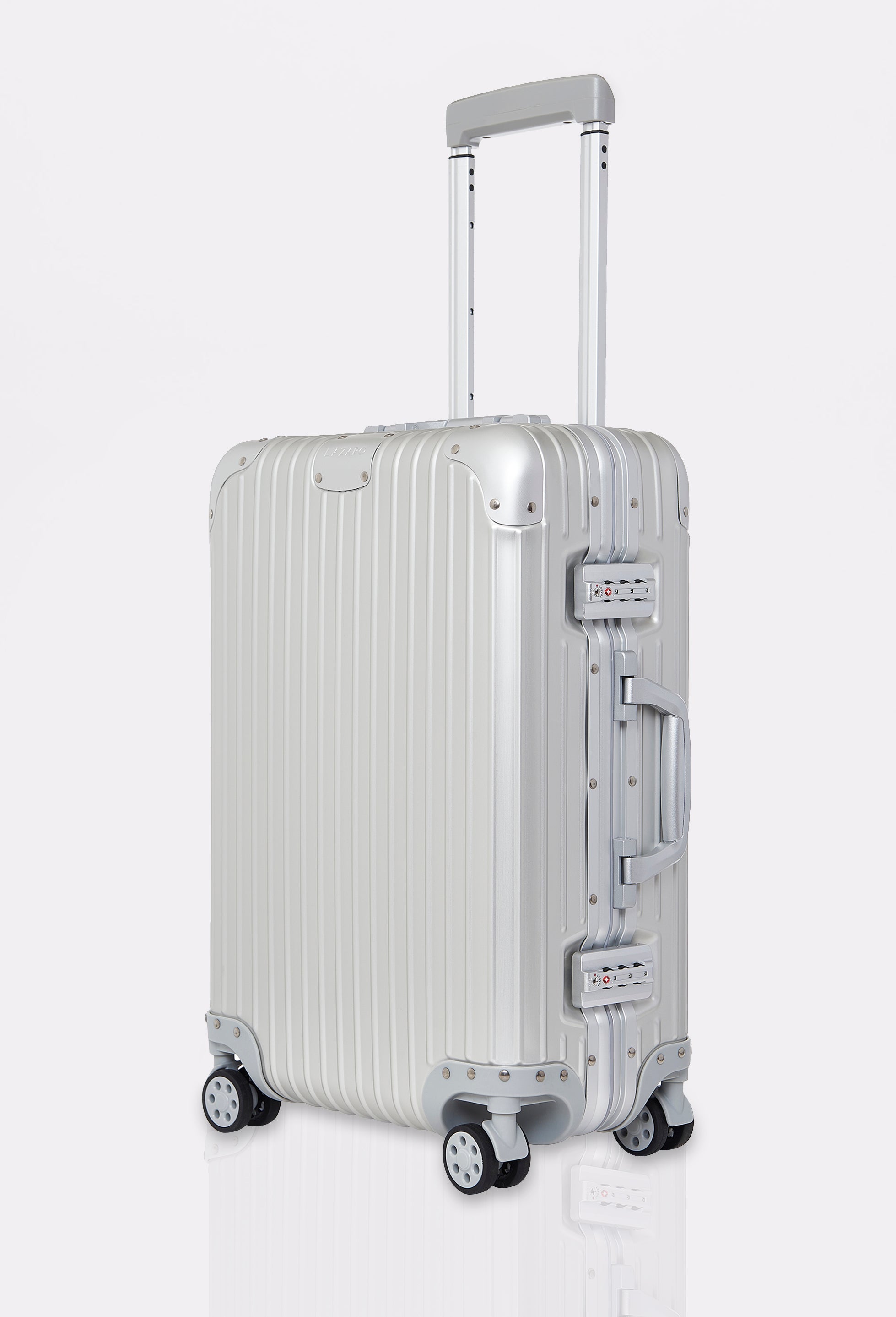 Side of a Silver Carry-On ‘Genesis’ 20, crafted from top-quality aluminum. Features two integrated TSA locks, adjustable handle and 360° wheels.