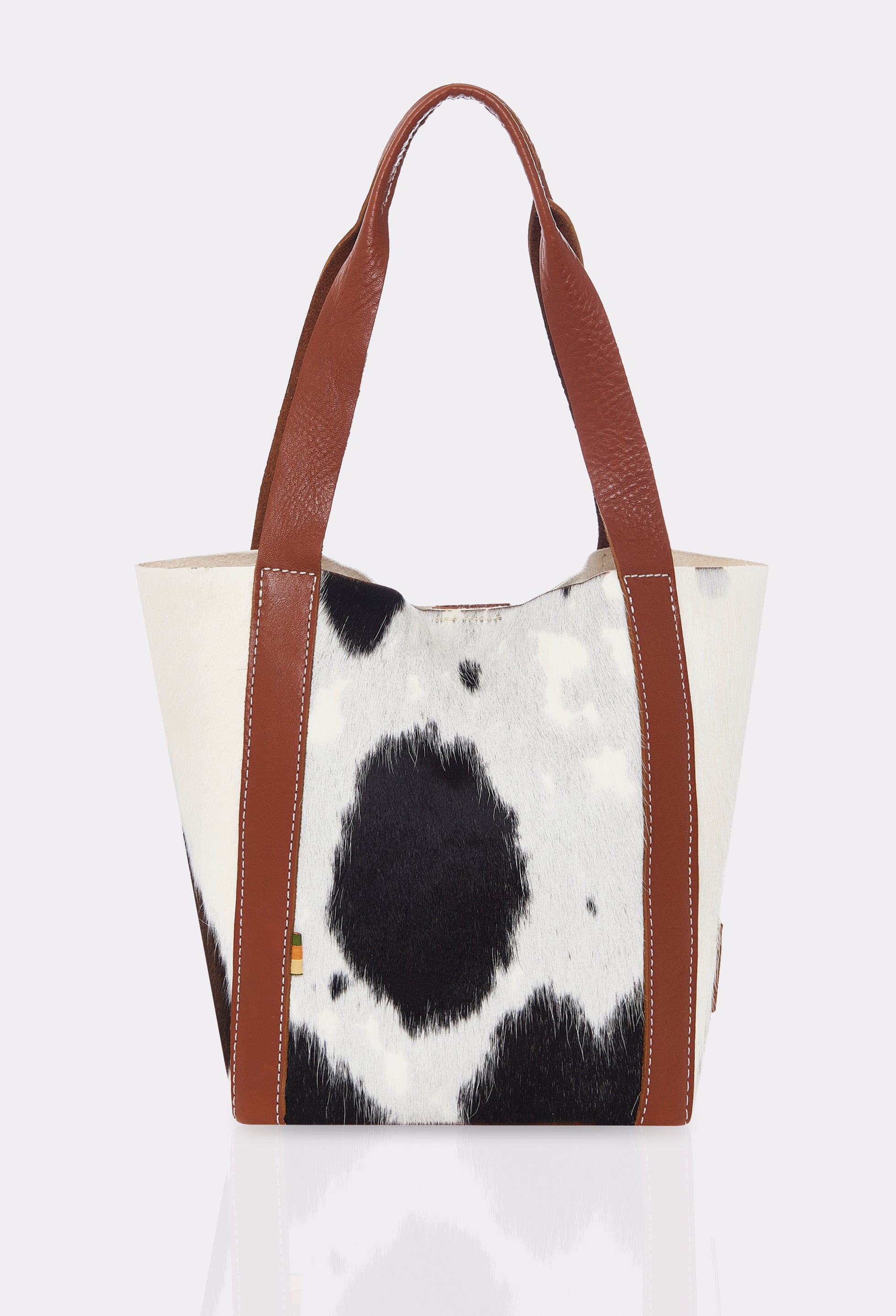 Rear of a Tan Cowhide Leather Mini Bucket Bag Ushuaia with contrast stitching highlights.