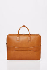 Rear of a Tan Leather Briefcase that shows a handle to attach the briefcase to a carry-on.