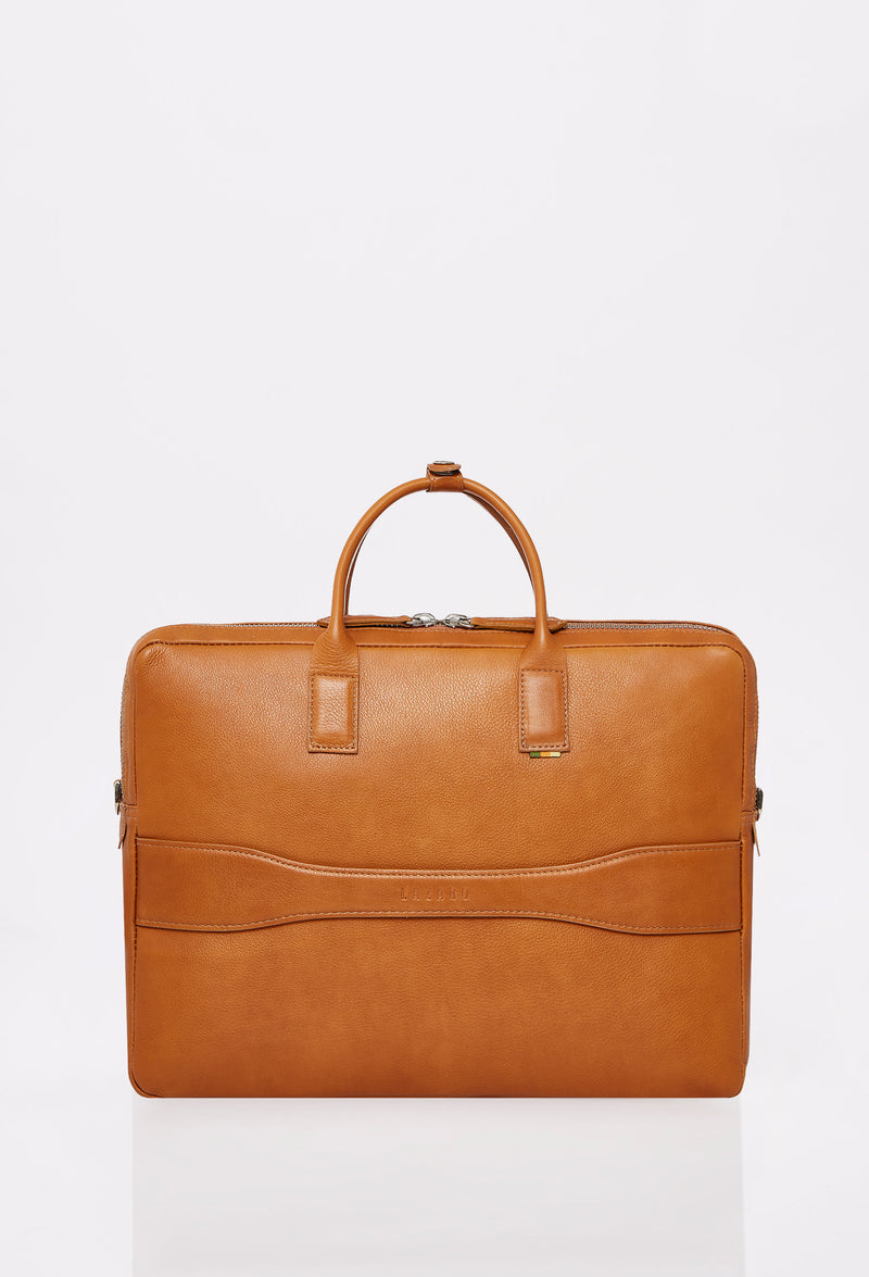 Rear of a Tan Leather Briefcase that shows a handle to attach the briefcase to a carry-on.