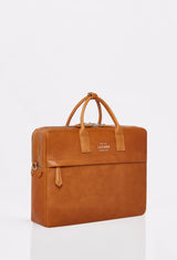 Side of a Tan Leather Briefcase with Lazaro logo, a zippered pocket in the front and a two-zippered main compartment.