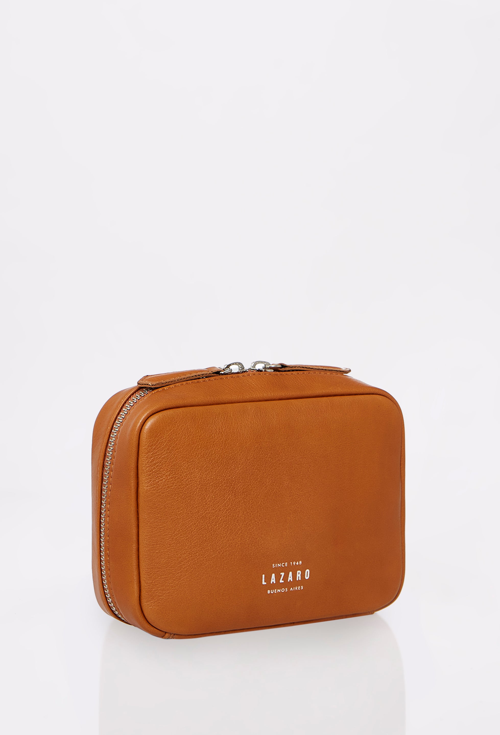 Side of a Tan Leather Tech Case Salerno with a wide zip-around opening and Lazaro embossed logo.