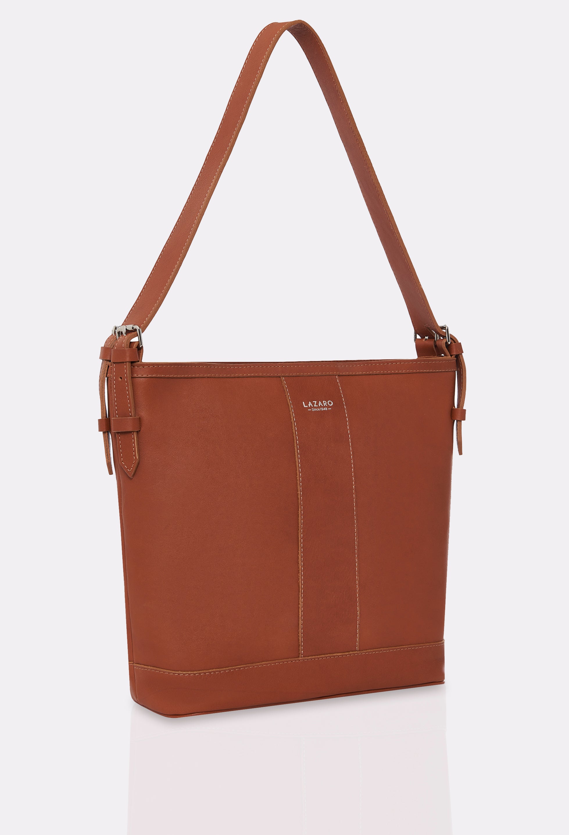 Side of a Tan Leather Tote Bag Montana with leather padded and adjustable strap and silver embossed Lazaro logo.