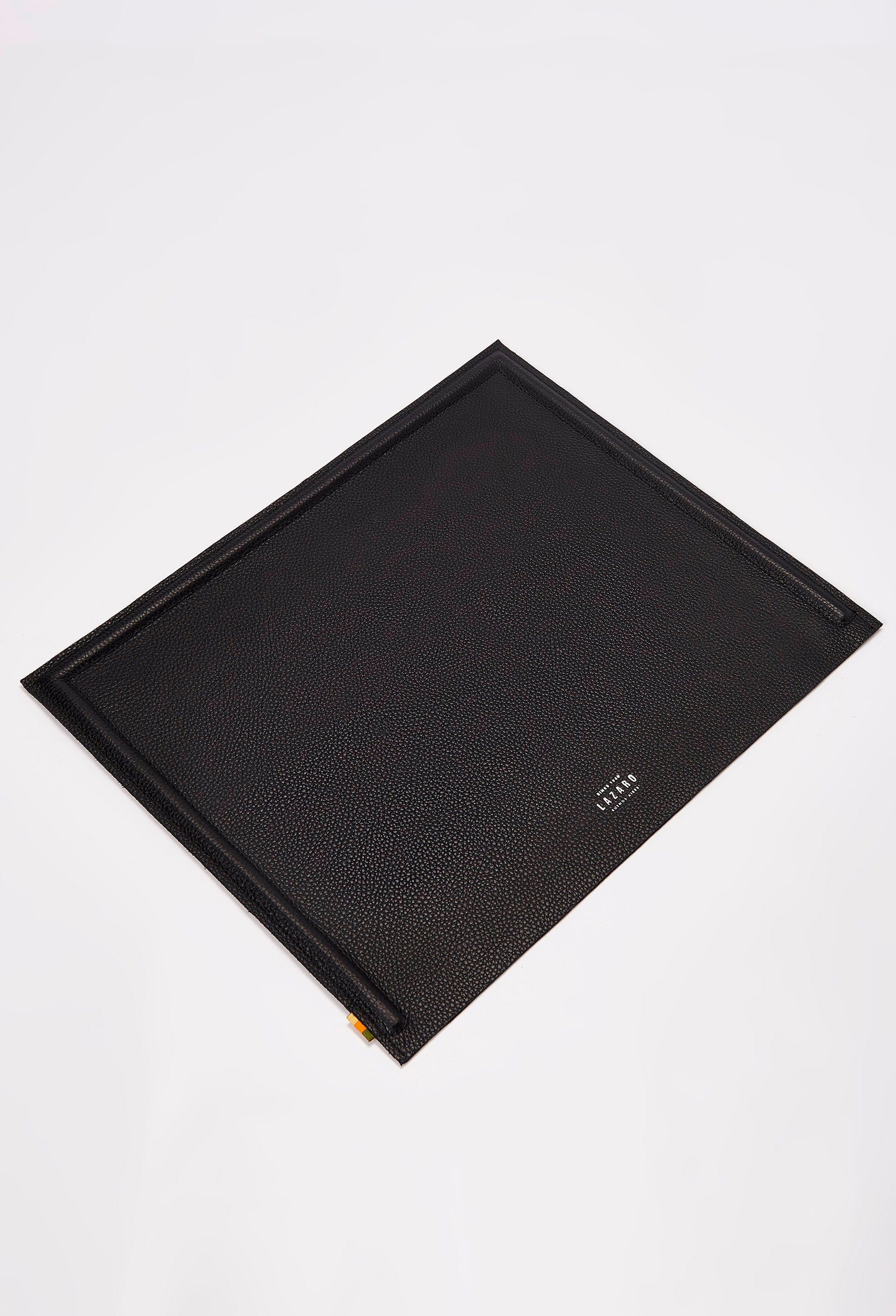 Front of a Black Leather Minimalist Desk Mat with embossed Lazaro logo on it.