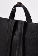 Partial photo of a Black Leather Tote Backpack with leather handles and padded and adjustable straps.