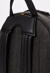 Partial photo of a Lightweight Canvas Backpack showing its ergonomically shaped rear, a leather handle and leather padded and adjustable straps.