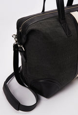 Partial photo of a Off White Large Canvas Duffel Bag with leather details, a zippered main compartment, and a detachable leather shoulder strap.
