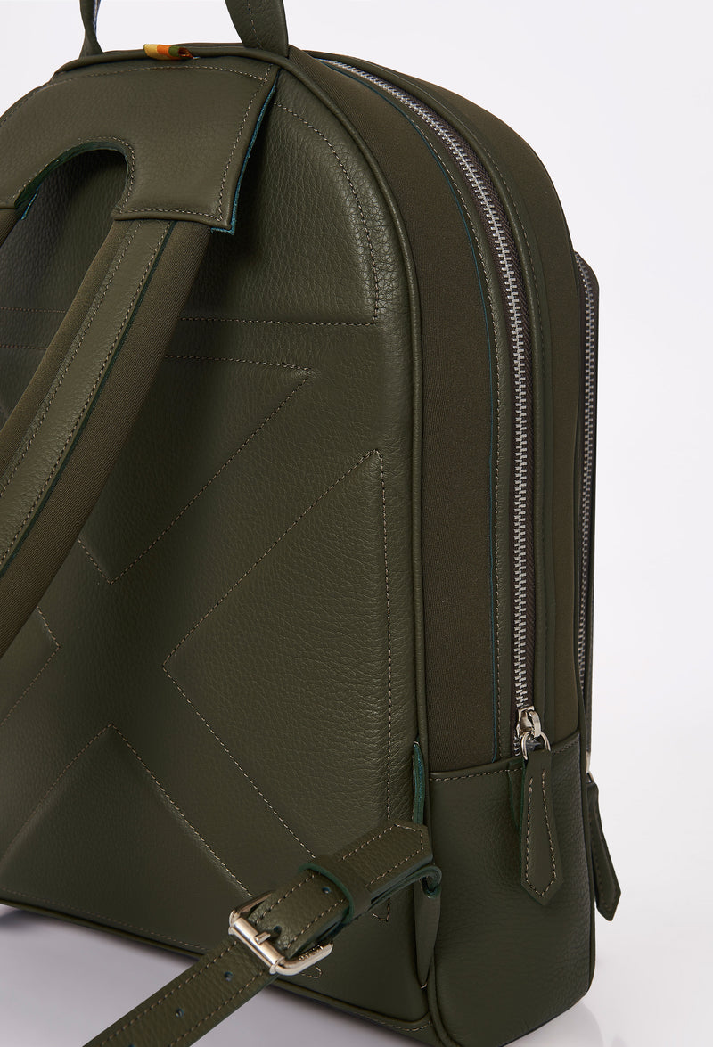 Partial photo of a Olive Neoprene and Leather Backpack with ergonomically shaped rear, leather and neoprene padded and adjustable straps.