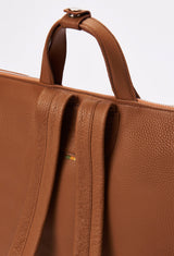 Partial photo of a Tan Leather Tote Backpack with leather handles and padded and adjustable straps.