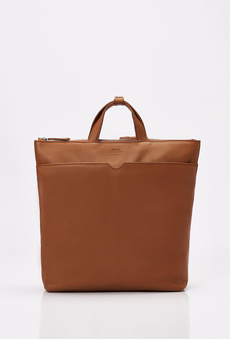 Front of a Tan Leather Tote Backpack with Lazaro logo and a front zippered pocket.