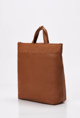 Side of a Tan Leather Tote Backpack with Lazaro logo and a front zippered pocket.