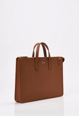Side of a Tan Leather Slim Briefcase with Lazaro logo.